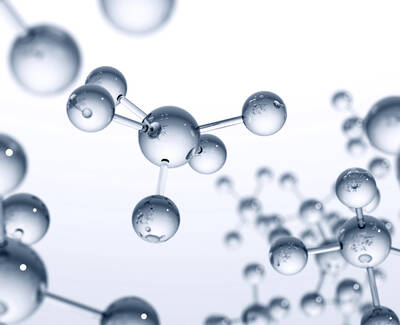 A cluster of transparent, spherical molecules connected by thin, visible bonds, set against a light background.