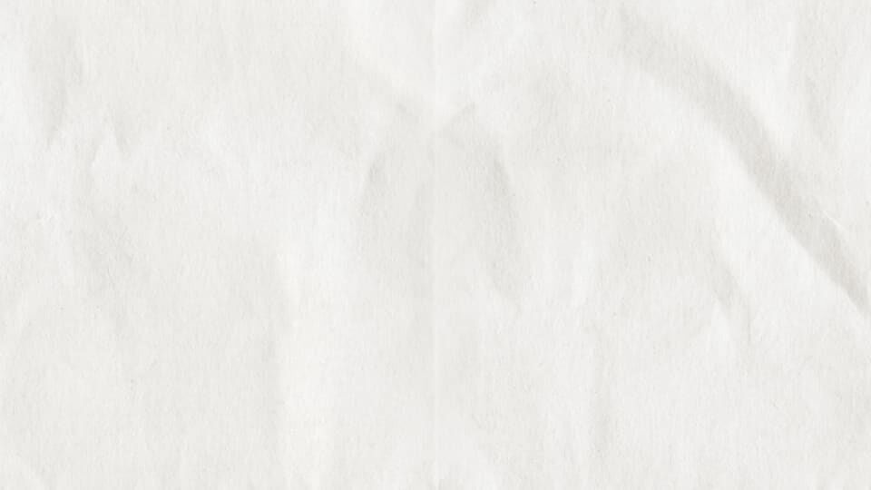 Kremovo biela textura s jemnymi vraskami.